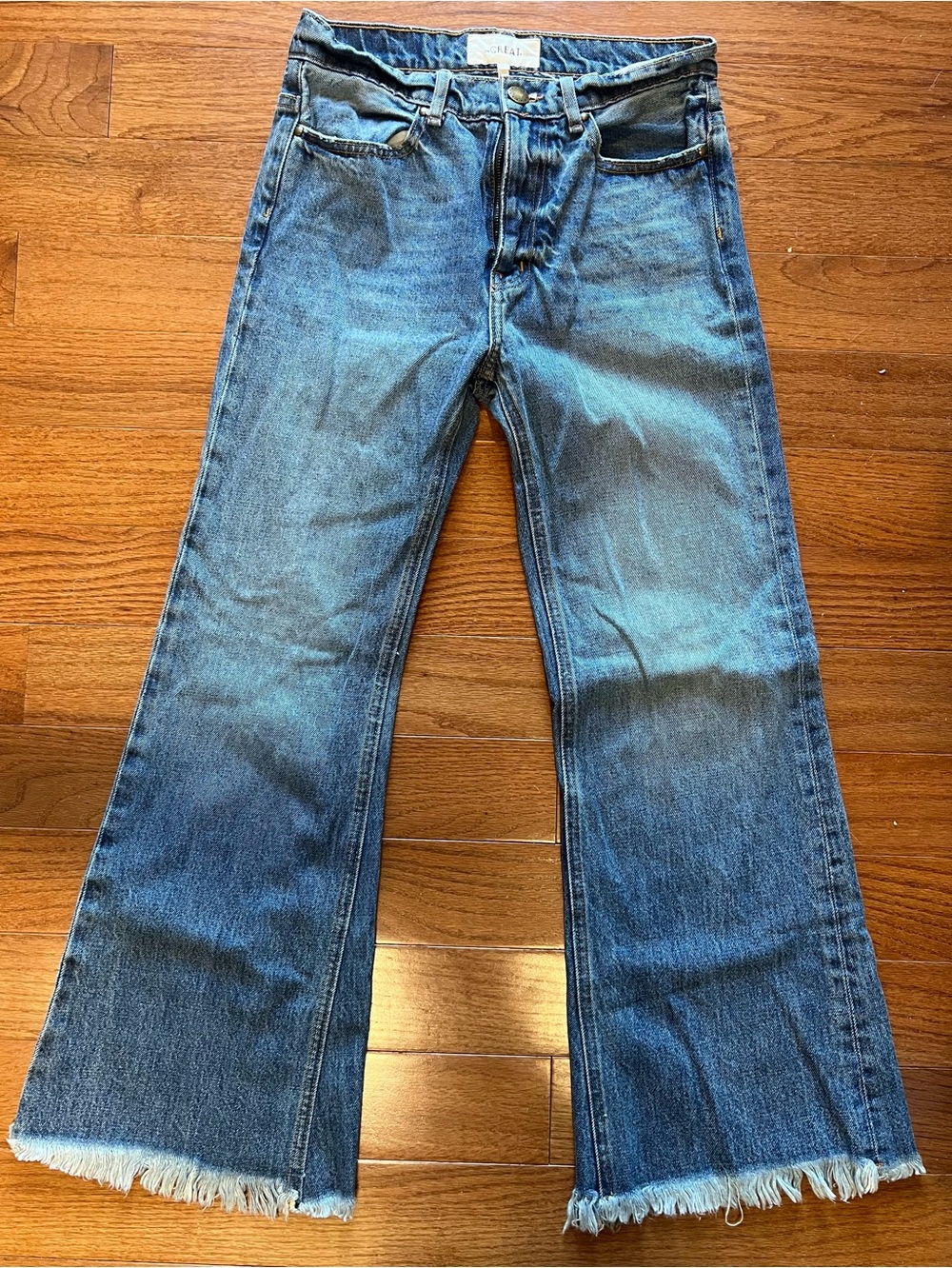 THE GREAT. Women's Mid-Blue Flared Jeans with Frayed Hem